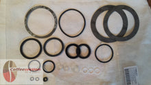 Load image into Gallery viewer, La Pavoni gasket set replacement with various rubber and metal gaskets laid out on a white cloth
